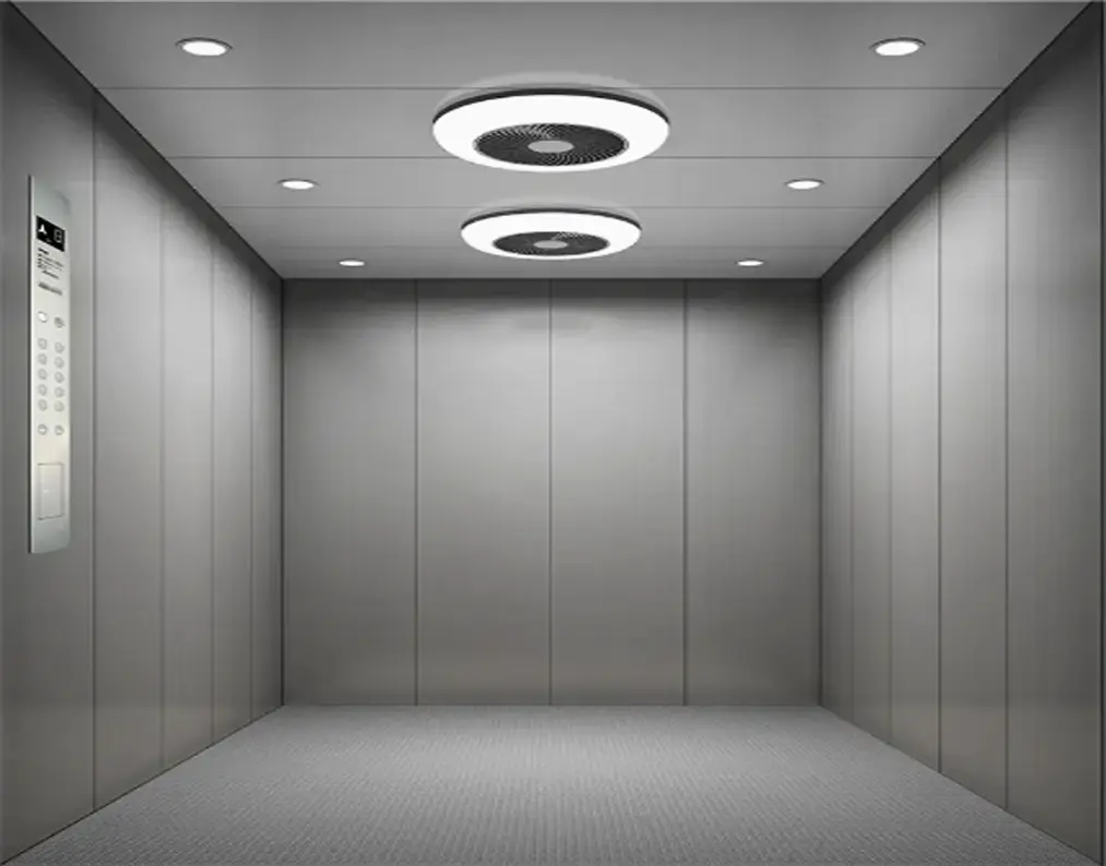 Cargo lift interior featuring a ceiling light illuminating the space.